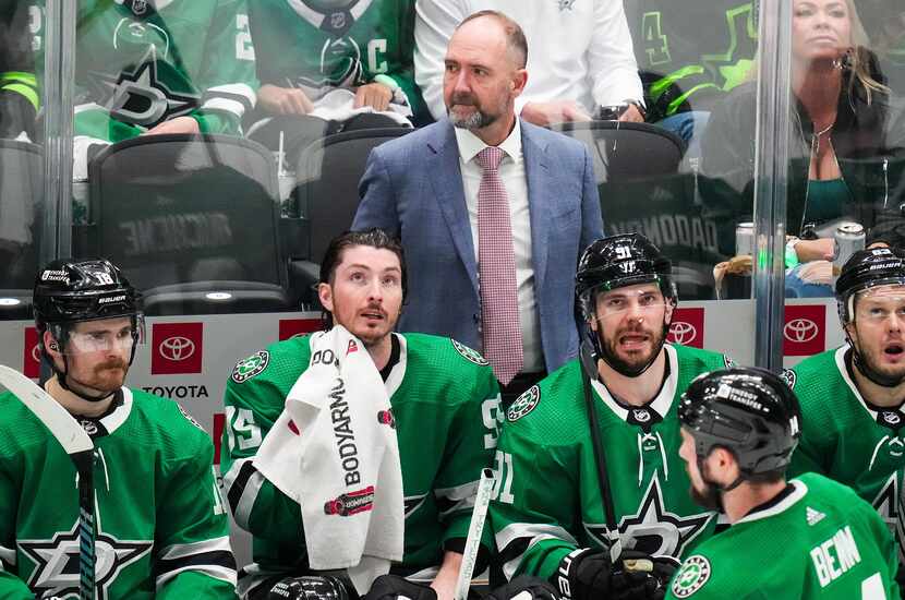 Dallas Stars head coach Pete DeBoer watches from the bench during the third period in Game 5...