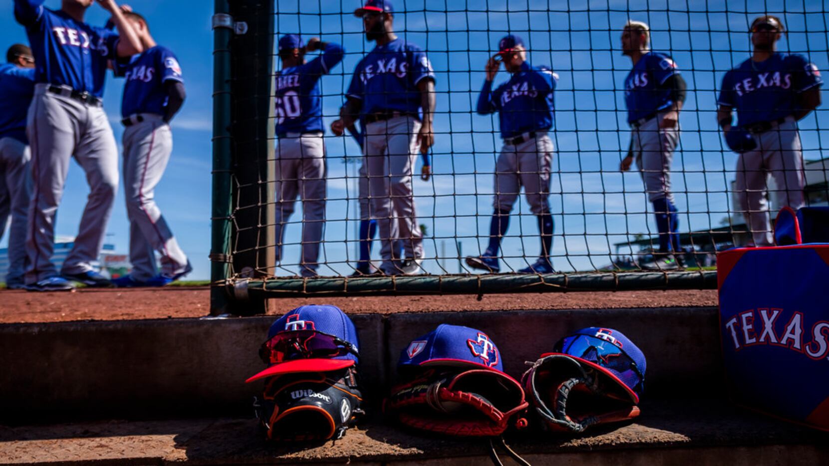 Texas Rangers players prepare to take the field  before a spring training baseball game...