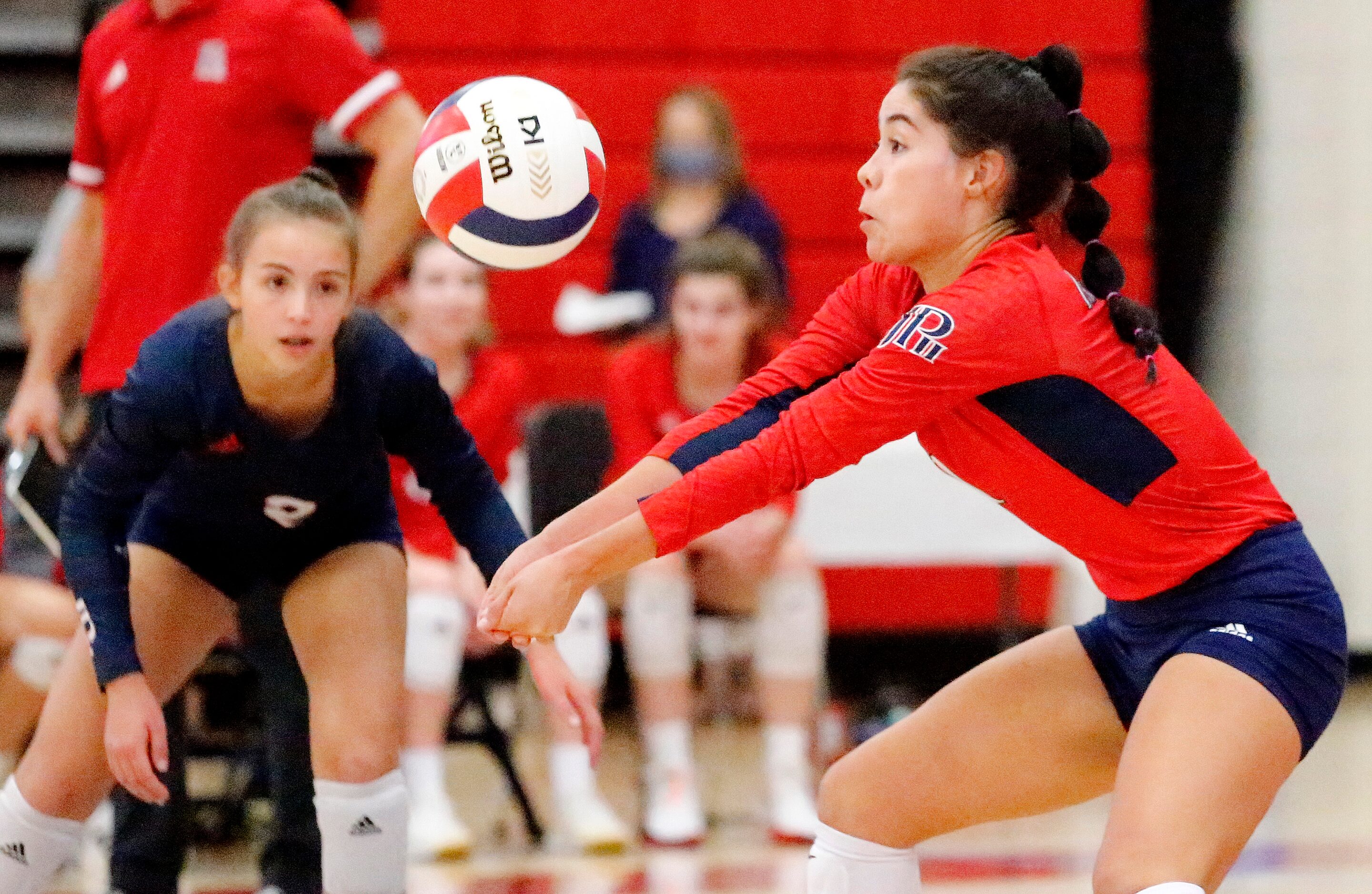 John Paul II High School defensive specialist Nicole Solis (1) receives a serve as John Paul...