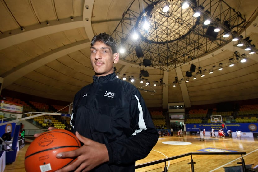 In this Sunday, Jan. 2, 2011 photo, Indian teenager Satnam Singh Bhamar poses with a...