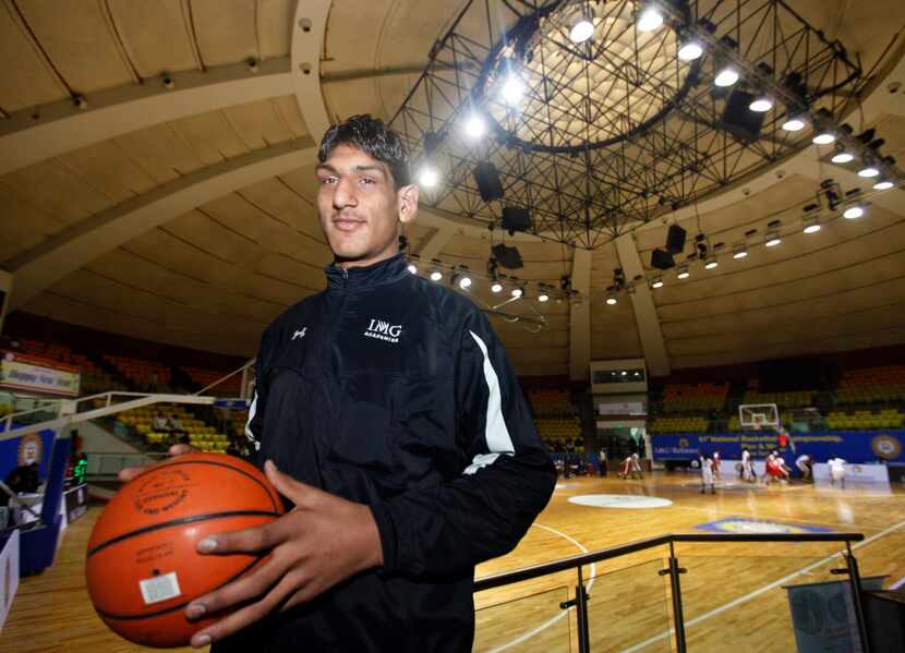 In this Sunday, Jan. 2, 2011 photo, Indian teenager Satnam Singh Bhamar poses with a...