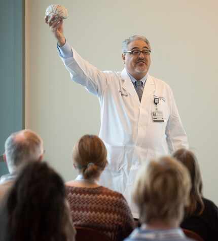 Neurologist Dr. Mark P. Goldberg, a professor at UT Southwestern Medical Center, gives an...