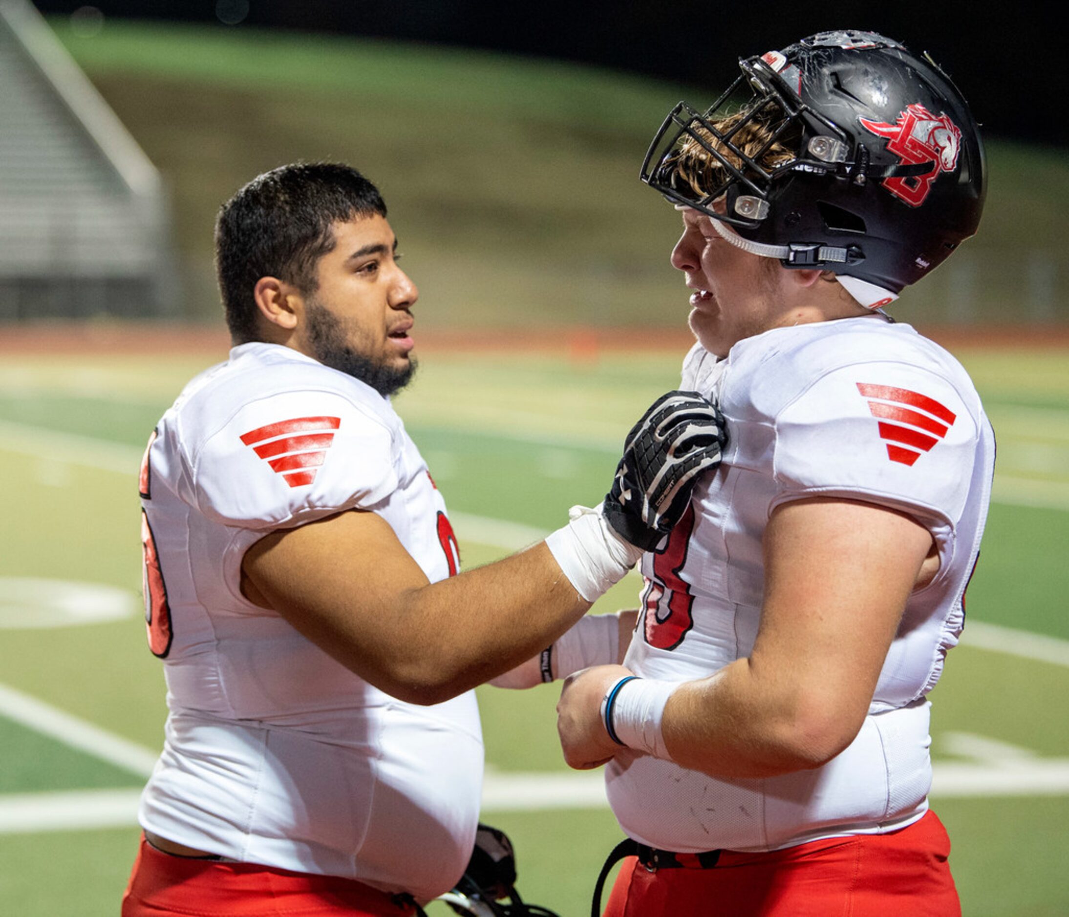 Mansfield LegacyÃs Ty Flores (53), right, is consoled by Marcos Avalos (66) after losing...