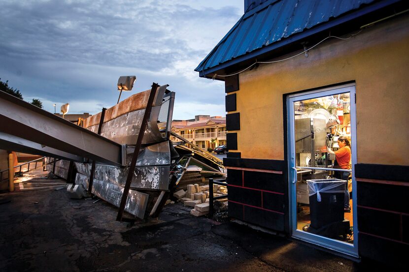 Employees worked in the kitchen of Buzzbrews diner in Dallas on June 27, mere feet away from...