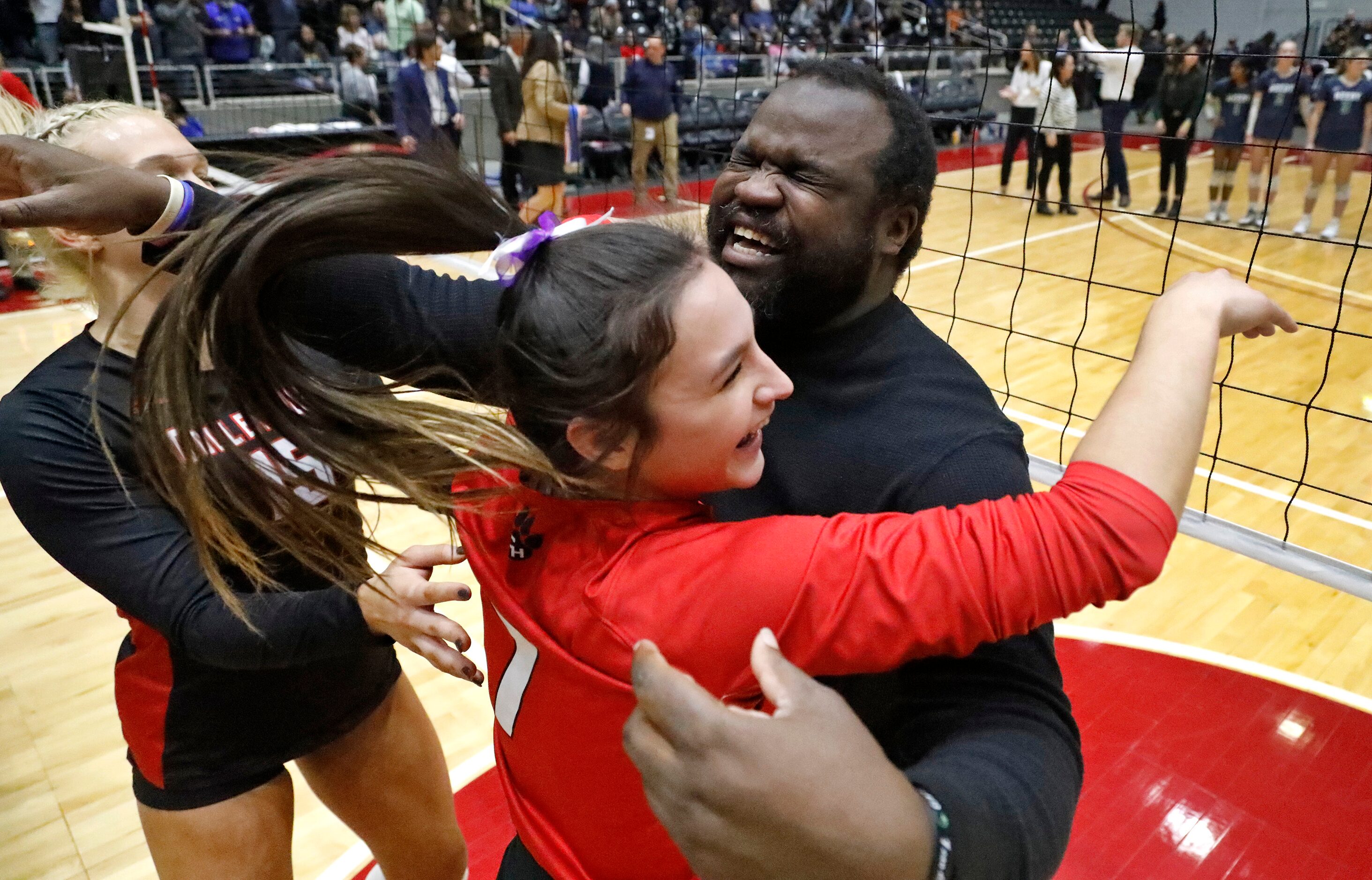 Colleyville Heritage High School's Reagan Engler (15) and Ava Ash (7) go to hug their head...