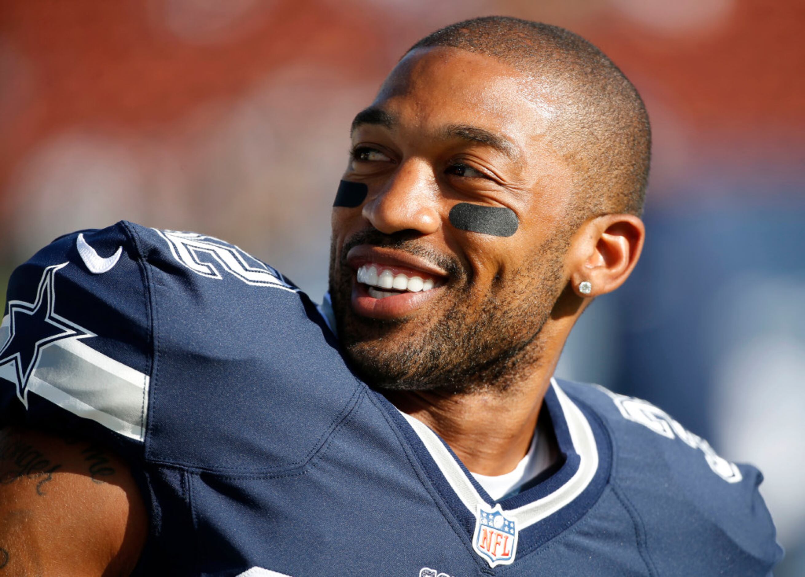 Dallas Cowboys cornerback Orlando Scandrick, left, has a discussion with  Rowdy the mascot before the Cowboys training camp at the Alamodome in San  Antonio, Texas, Thursday, July 30, 2009. (Photo by Ron