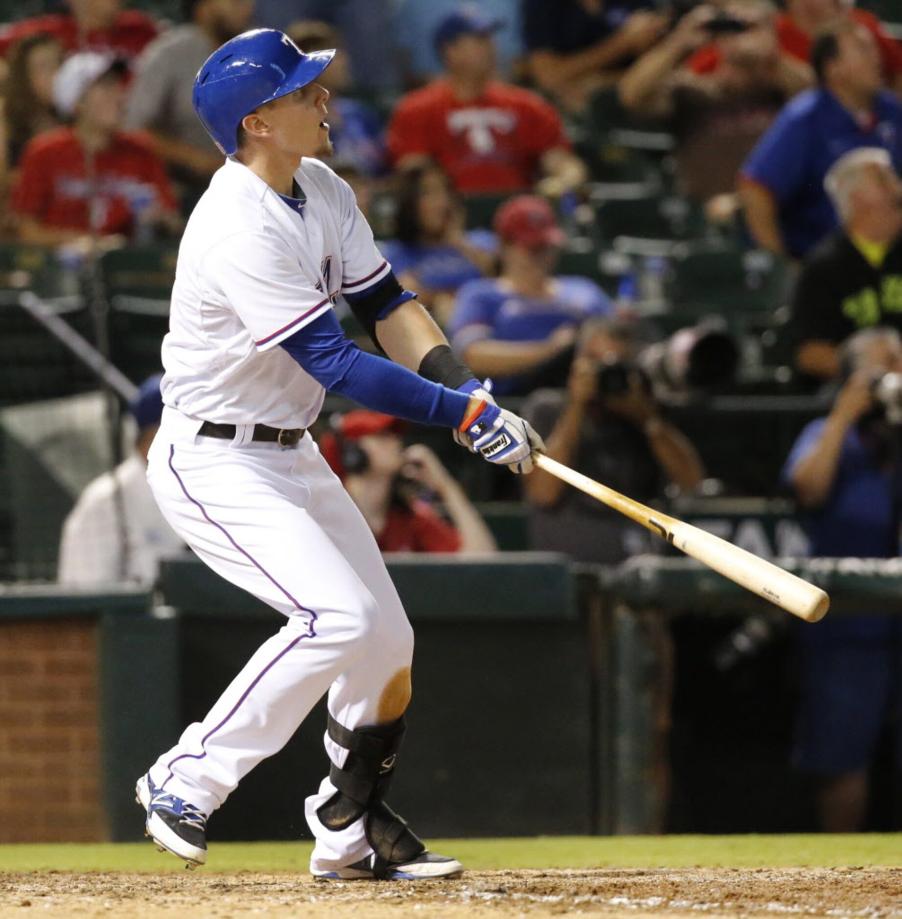 Texas rookie Ryan Rua watches the flight of his three-run homer in the seventh inning during...