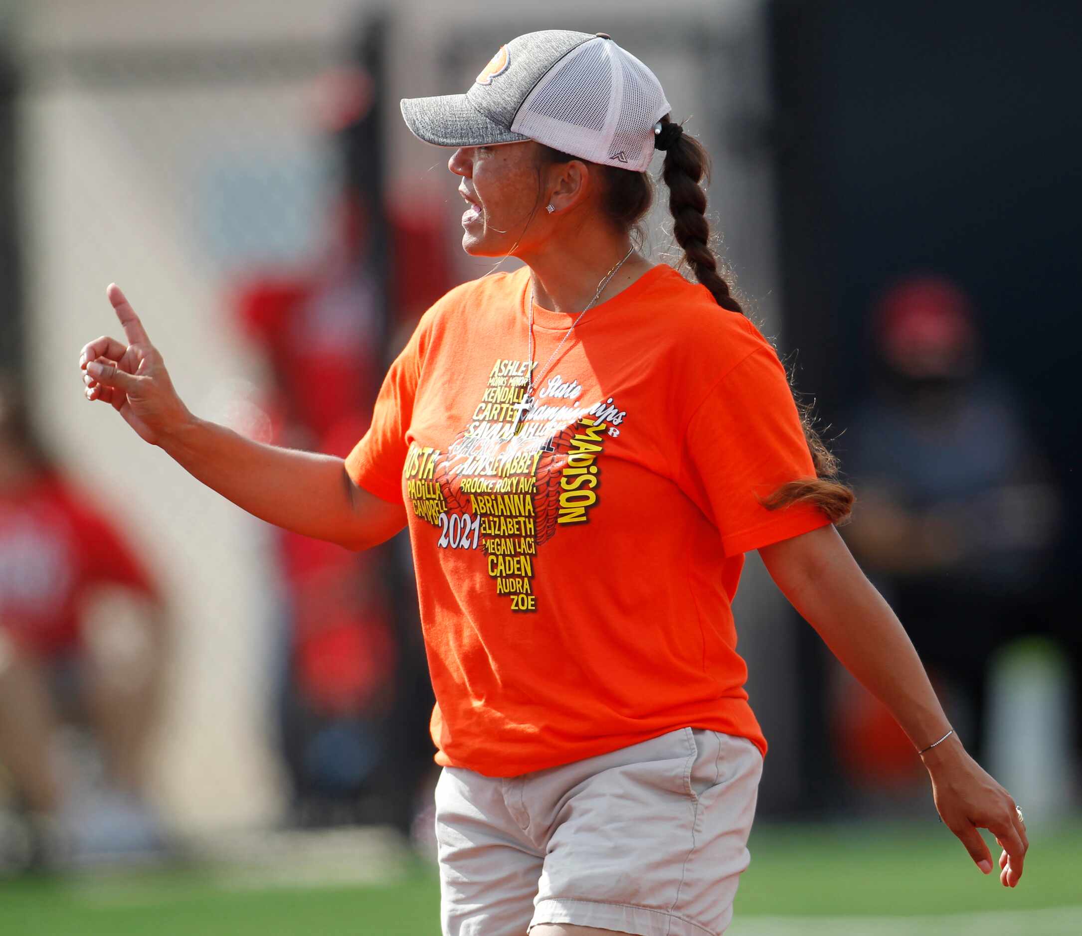 Rockwall head coach Shadie Acosta converses with the plate umpire after a mound visit during...