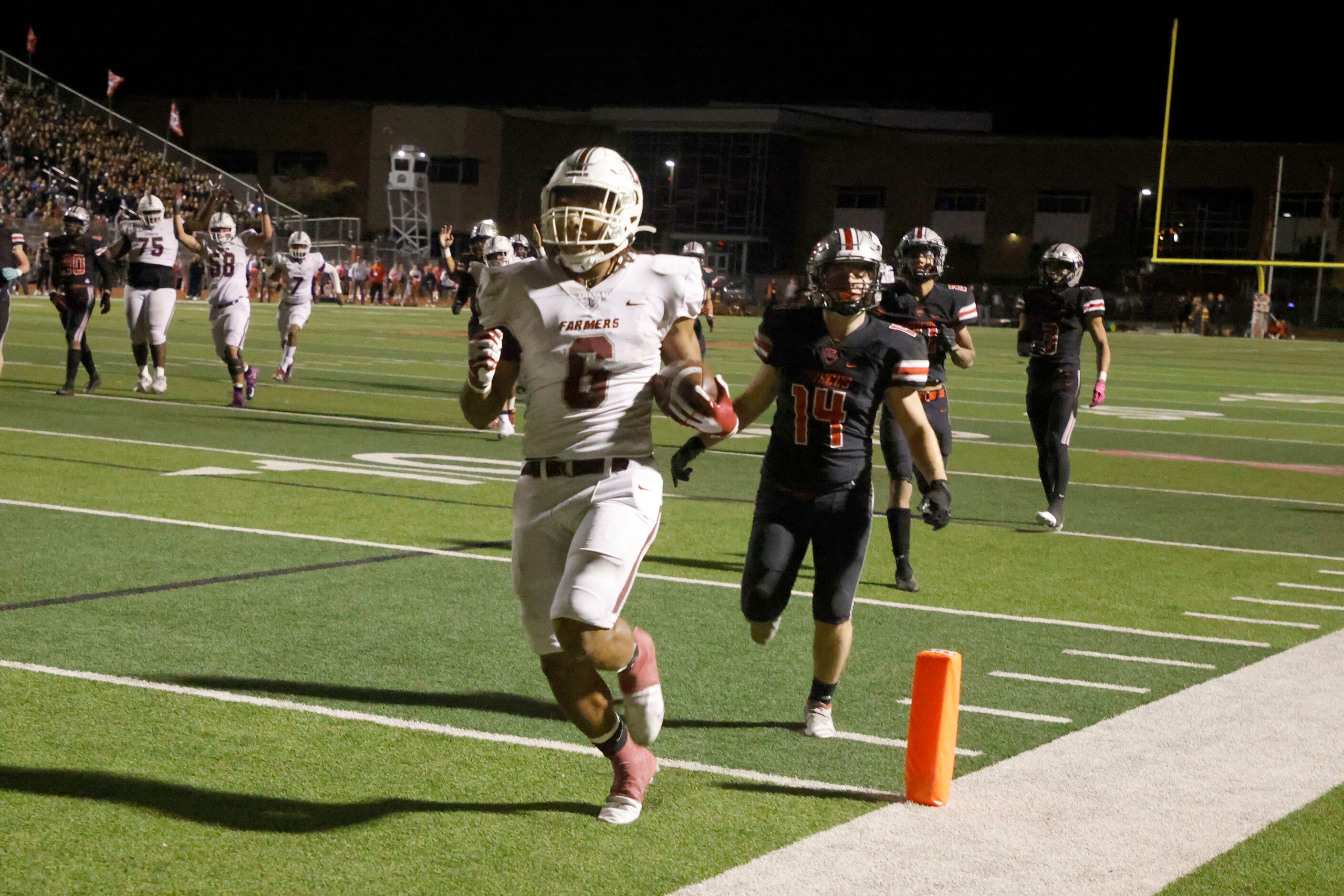 Lewisville running back Damien Martinez 96) scores a rushing touchdown against Flower Mound...