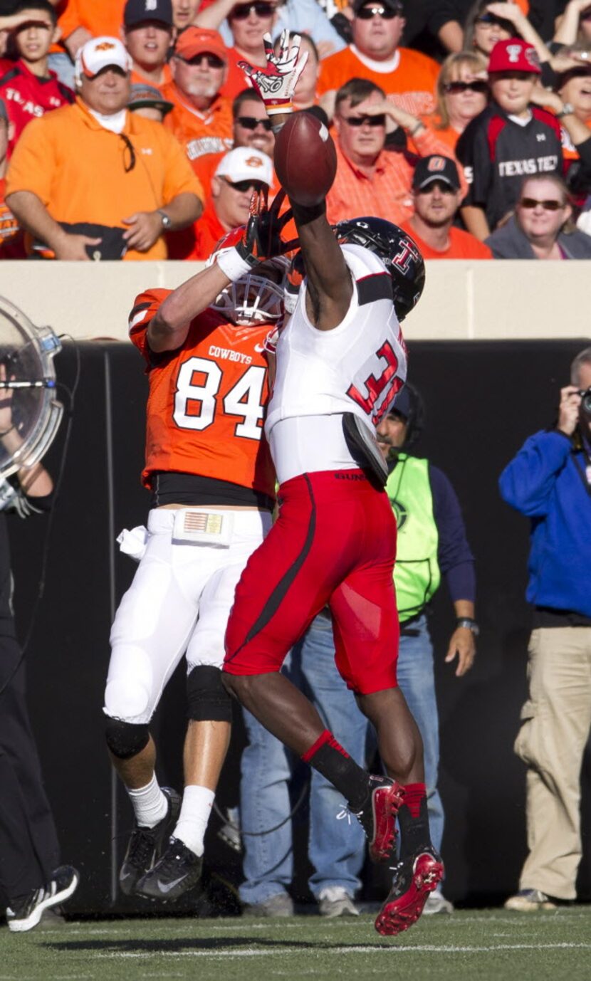 Nov 17, 2012; Stillwater OK, USA; Texas Tech Red Raiders cornerback Eugene Neboh (31) block...