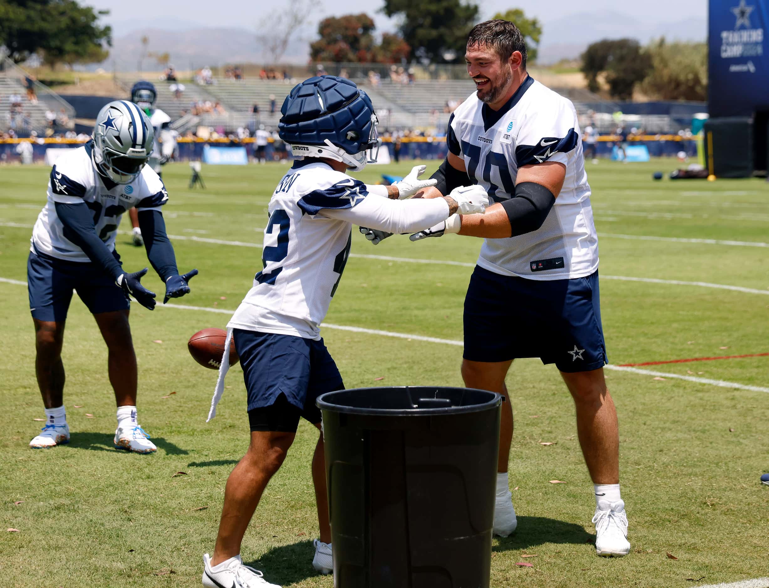 Dallas Cowboys guard Zack Martin (70), one of the largest players on the team, jumped in to...