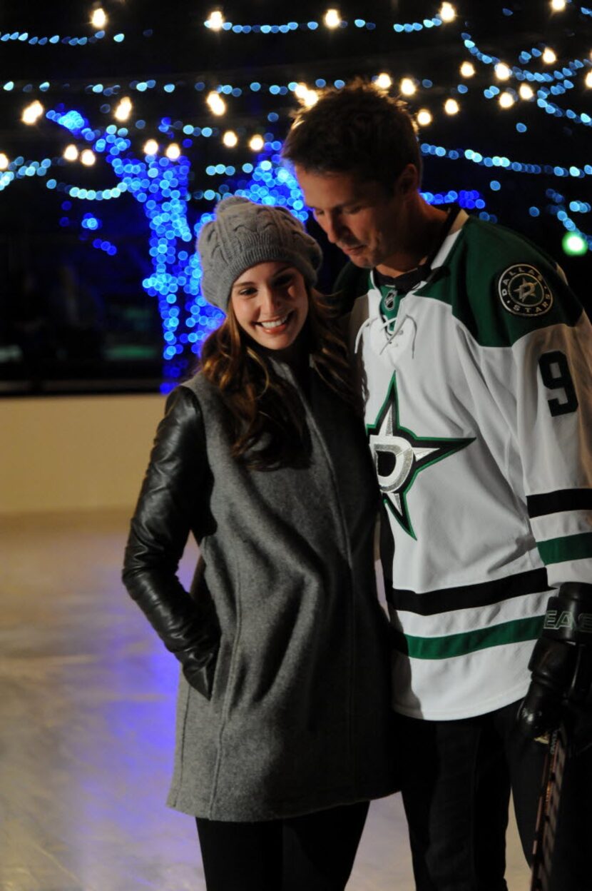 Mike Modano and wife Allison Micheletti skate on the ice at the grand opening of Sparkle...