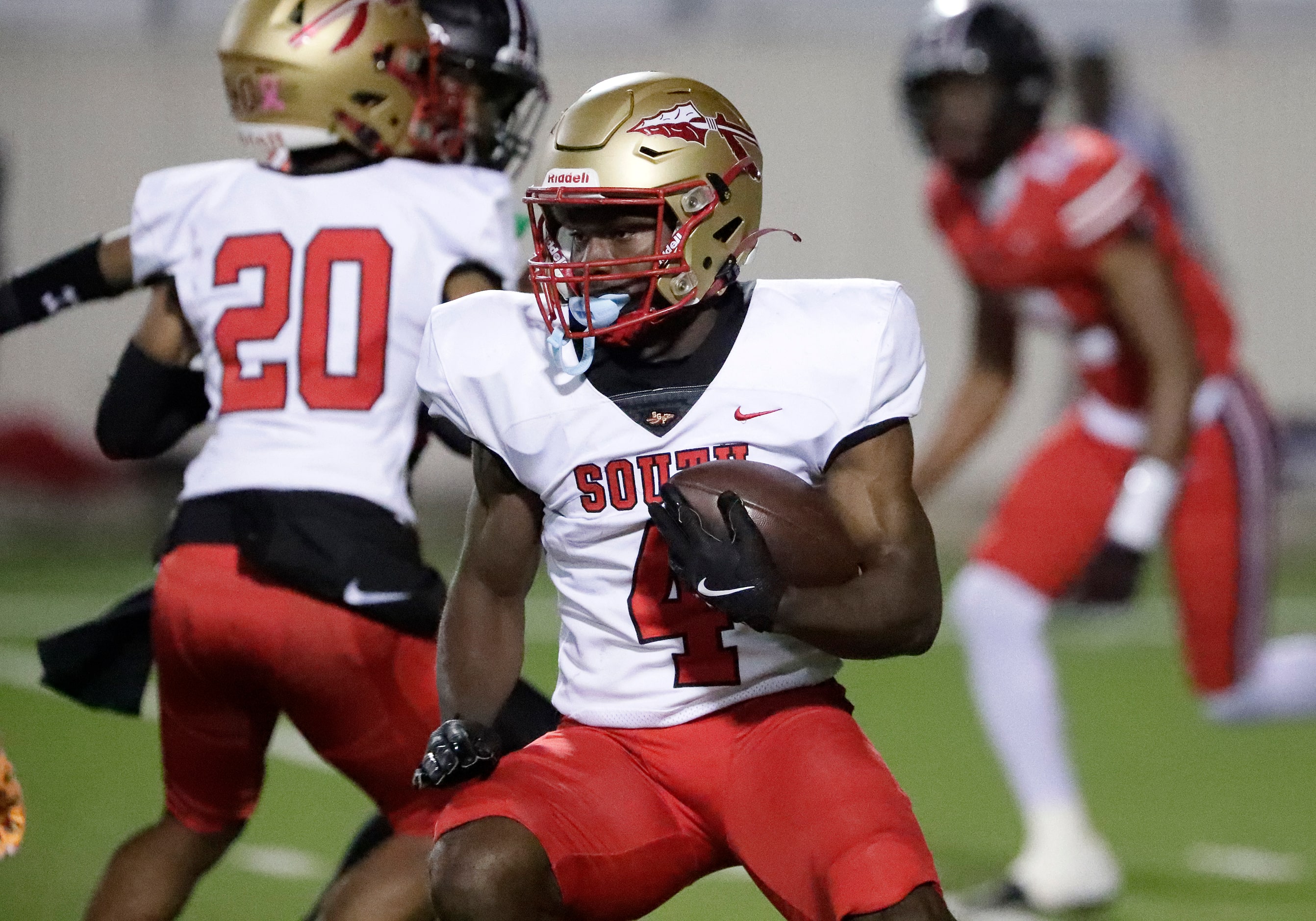 South Grand Prairie High School running back Josiah Lucas (4) looks for room to run on a...