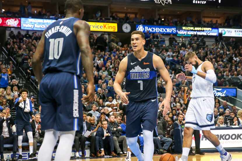 Dallas Mavericks forward Dwight Powell (7) reacts after forward Dorian Finney-Smith (10)...