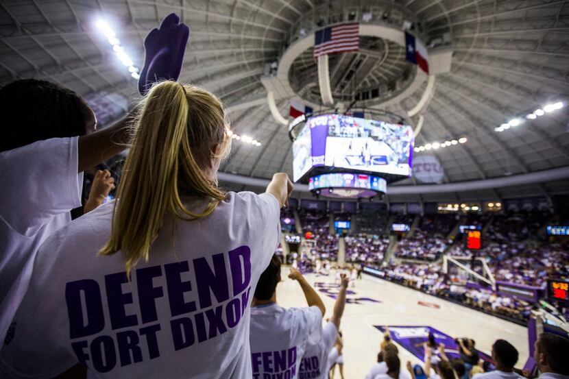 TCU Horned Frogs students wear t-shirts that say "Defend Fort Dixon," which is a combination...