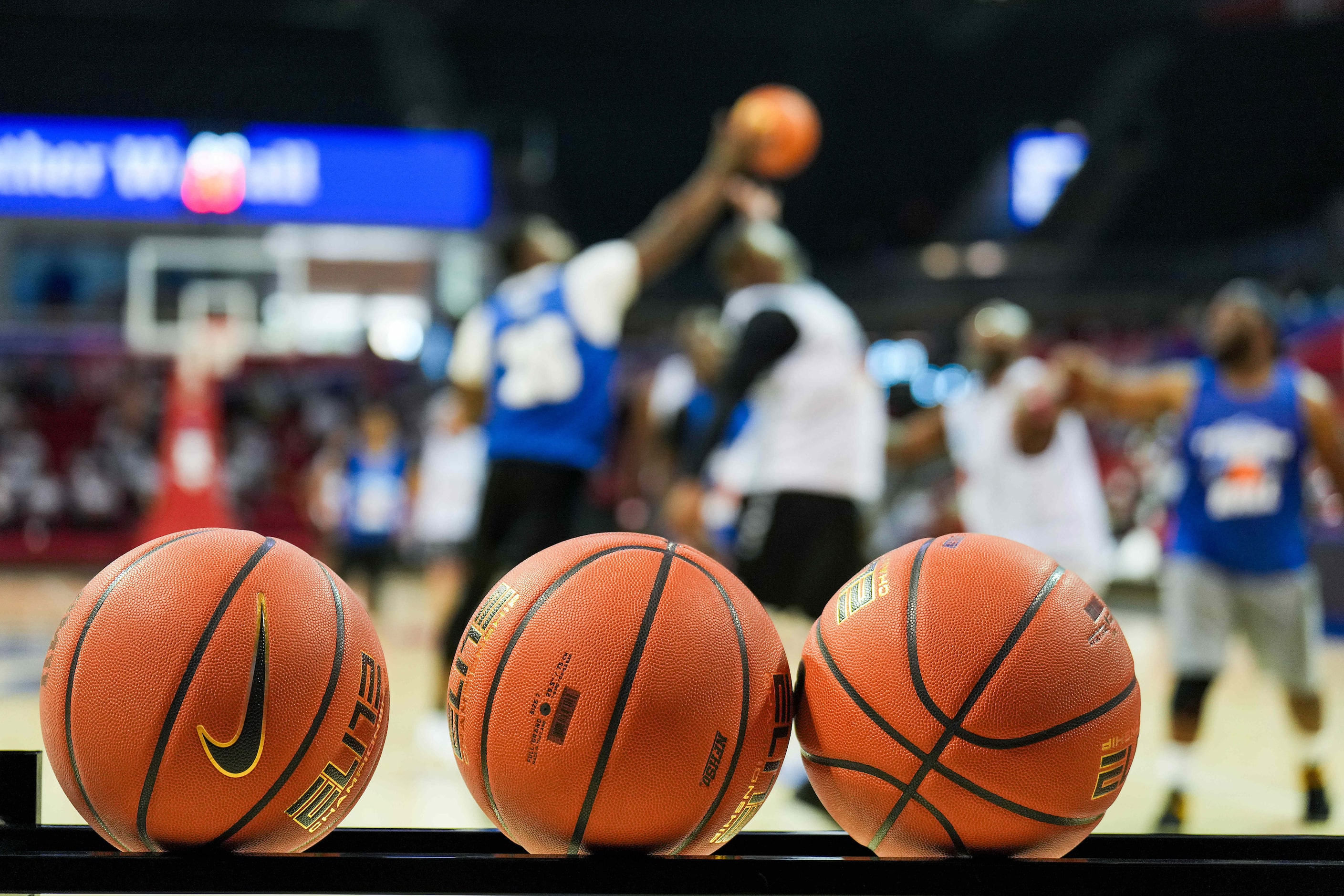 Players battle for a rebound during the 8th Annual Together We Ball basketball game at Moody...