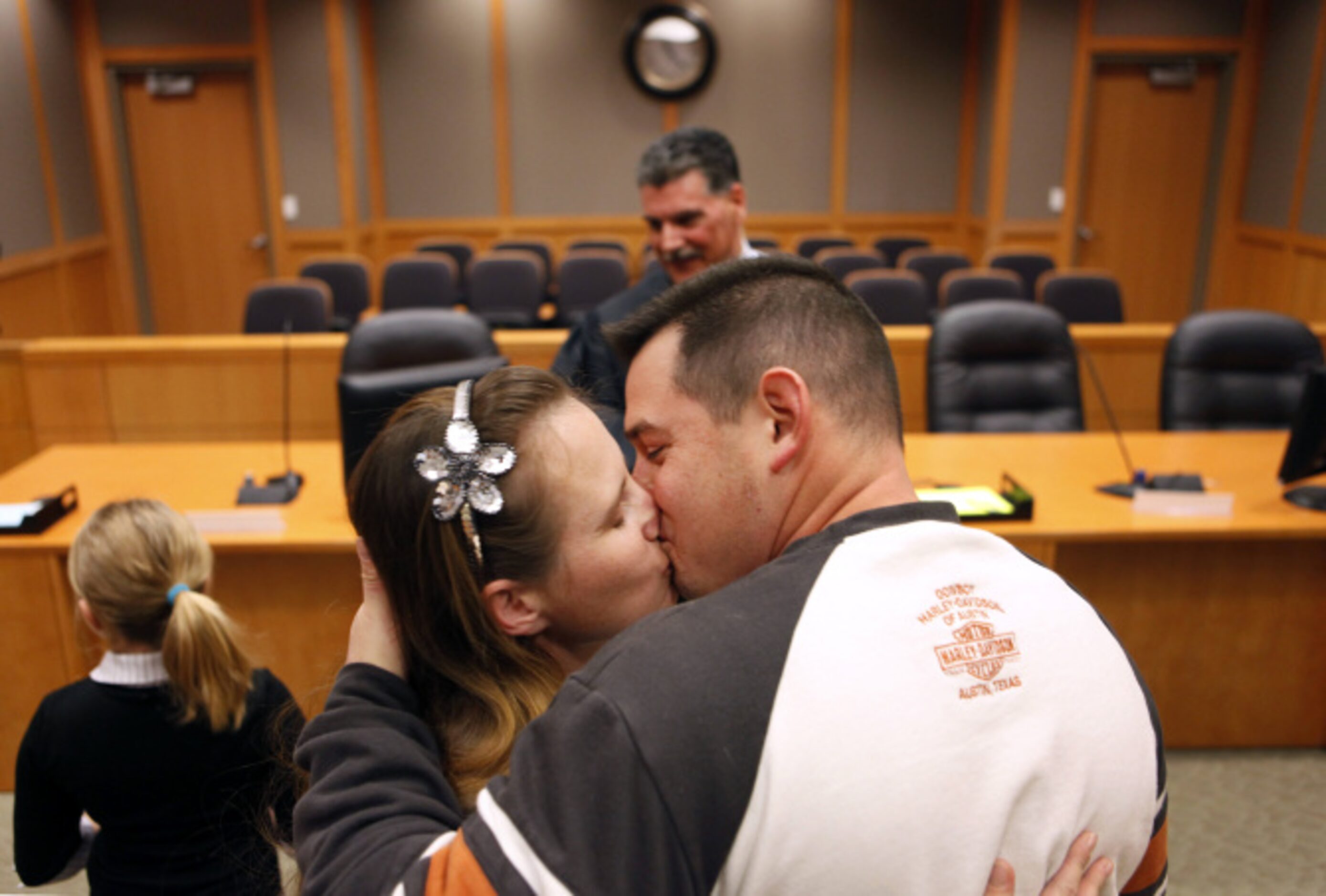 Stacey (right) and Chrystal Flournoy kiss after being married by Justice of the Peace Paul...