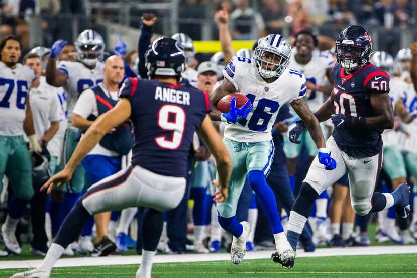 Cowboys wide receiver Cedrick Wilson (16) returns a punt during the second quarter of a...