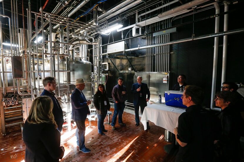 A group tours during an open house of Revolver Brewing BLDG 5, a new working brewery at...