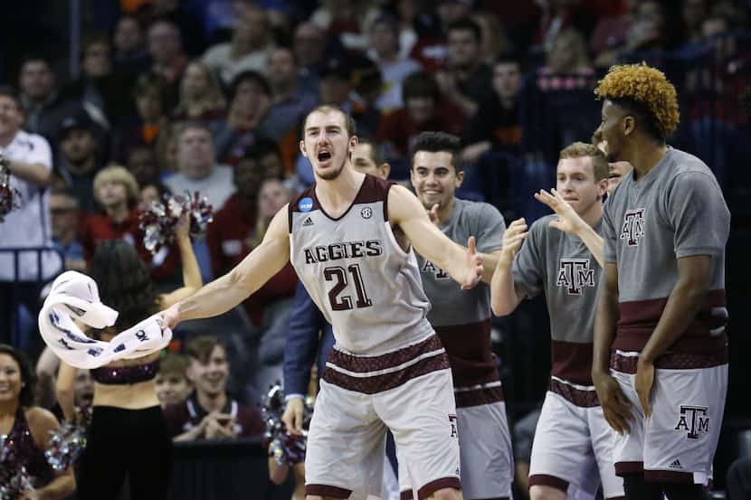 Texas A&M guard Alex Caruso (21) cheers on the bench in the second half of a first-round...