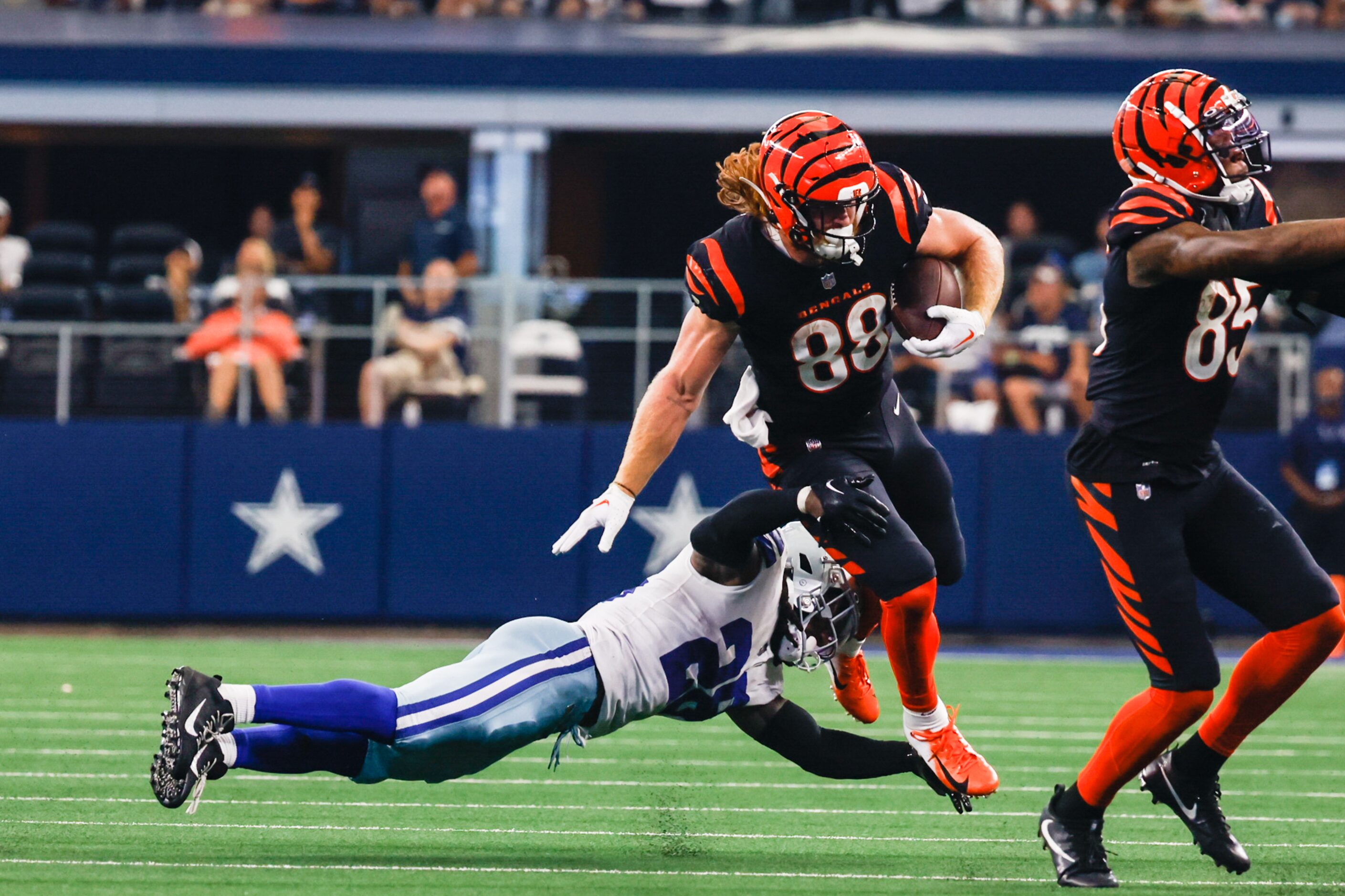 Dallas Cowboys safety Malik Hooker (28) attempts to tackle Cincinnati Bengals tight end...