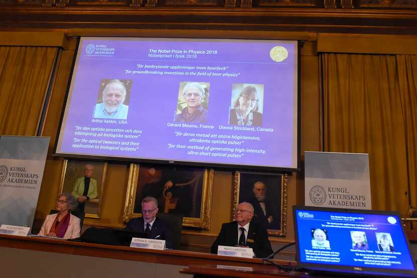 The 2018 Nobel Prize laureates for physics were shown Tuesday (from left), Arthur Ashkin of...