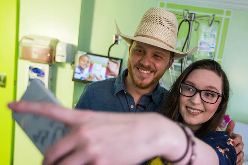 Danielle Grey, right, takes a selfie with Singer-songwriter Cody Johnson during a surprise...