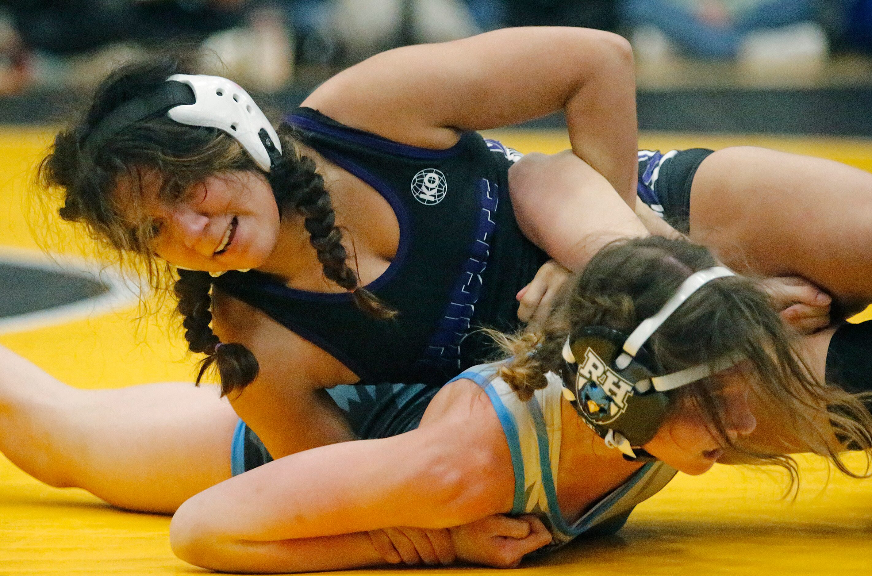 Diana Carreon (top) of Frisco Independence High School, competes with Brooke Wieczorek of...