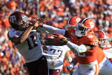 CLEMSON, S.C. - SEPT. 07: K'Von Wallace #12 of the Clemson Tigers runs into Kellen Mond #11...