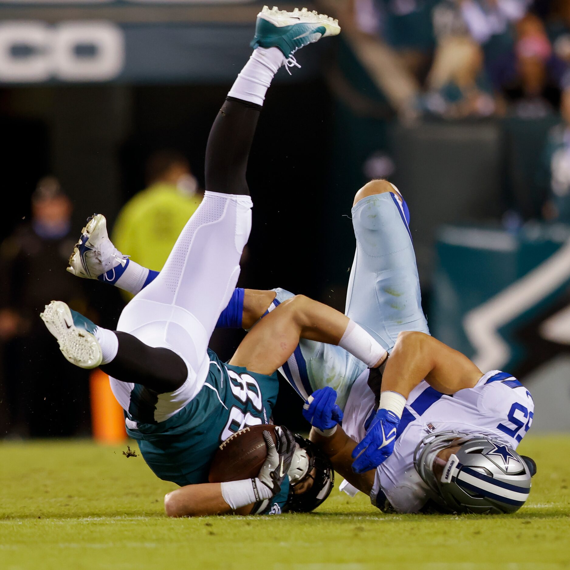 Dallas Cowboys linebacker Leighton Vander Esch (55) tackles Philadelphia Eagles tight end...