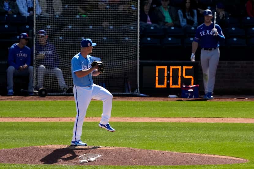 Kansas City Royals Nick Wittgren throws before a pitch clock runs down during the fifth...