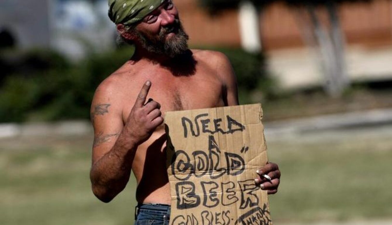 Un hombre que solo se identificó como “Woodstock” pide a los automovilistas del Northwest...