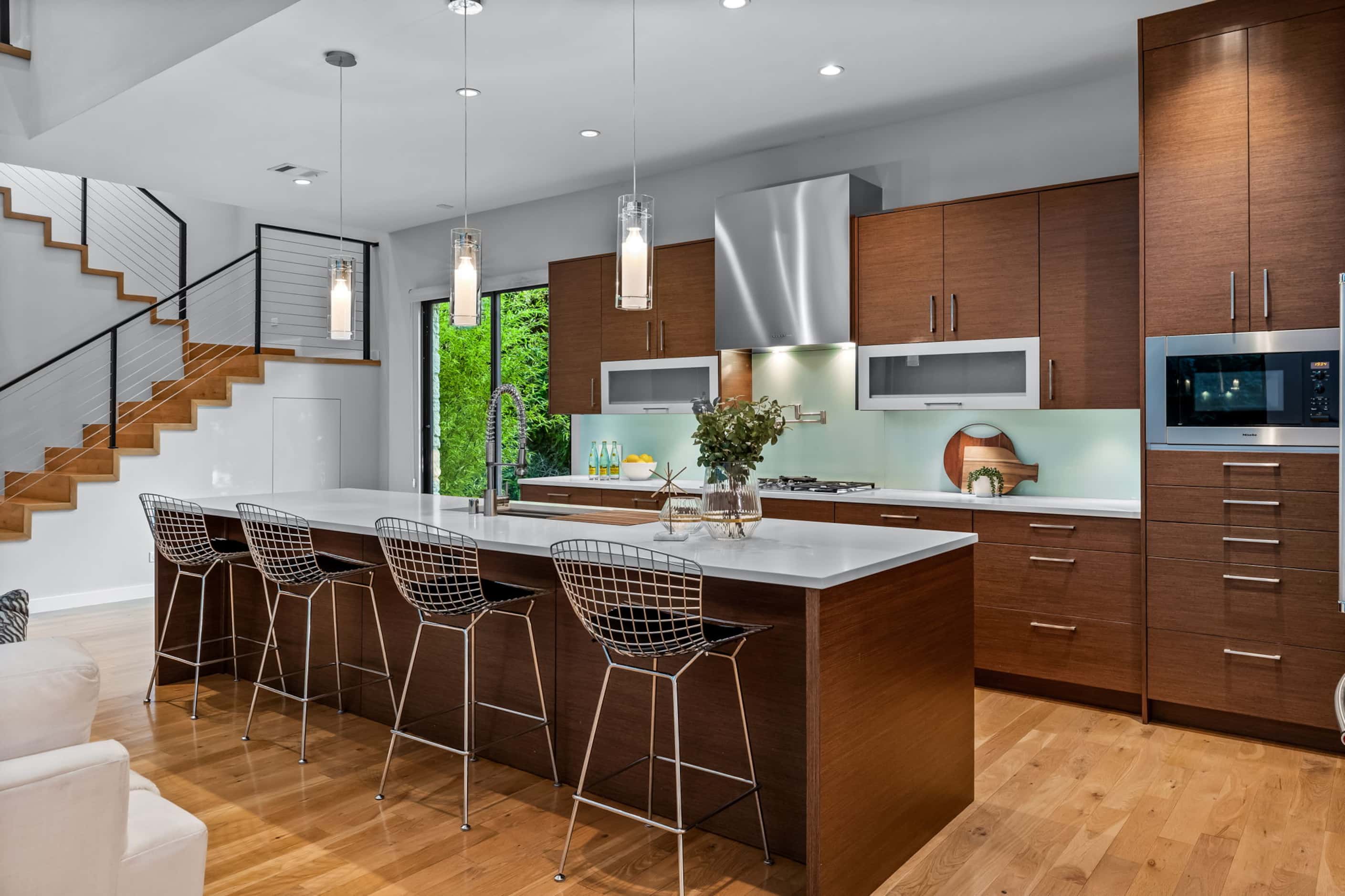Contemporary kitchen, large island, wood cabinets