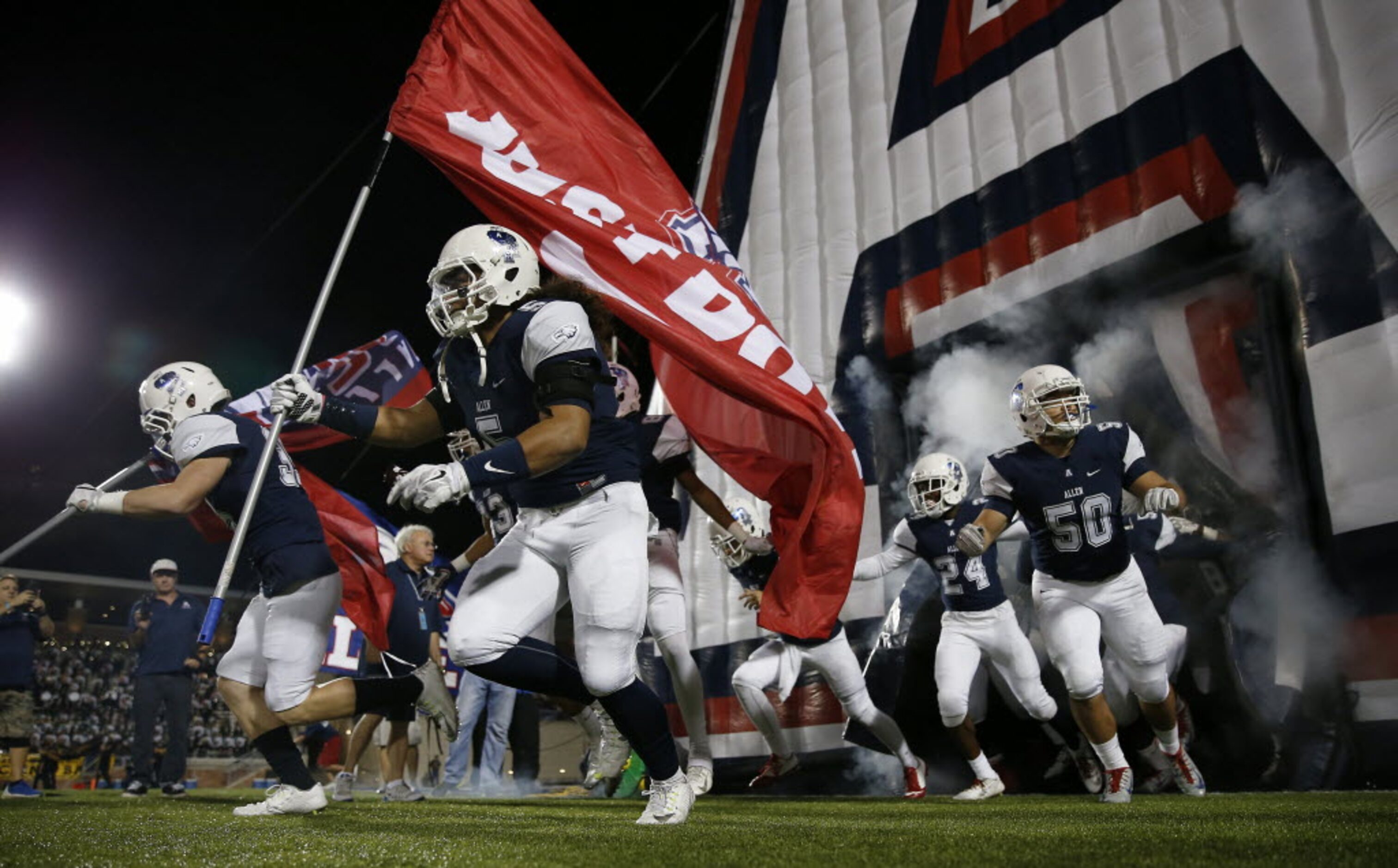 Allen football players take the field against Plano East at Eagle Stadium on Friday, Nov. 6,...