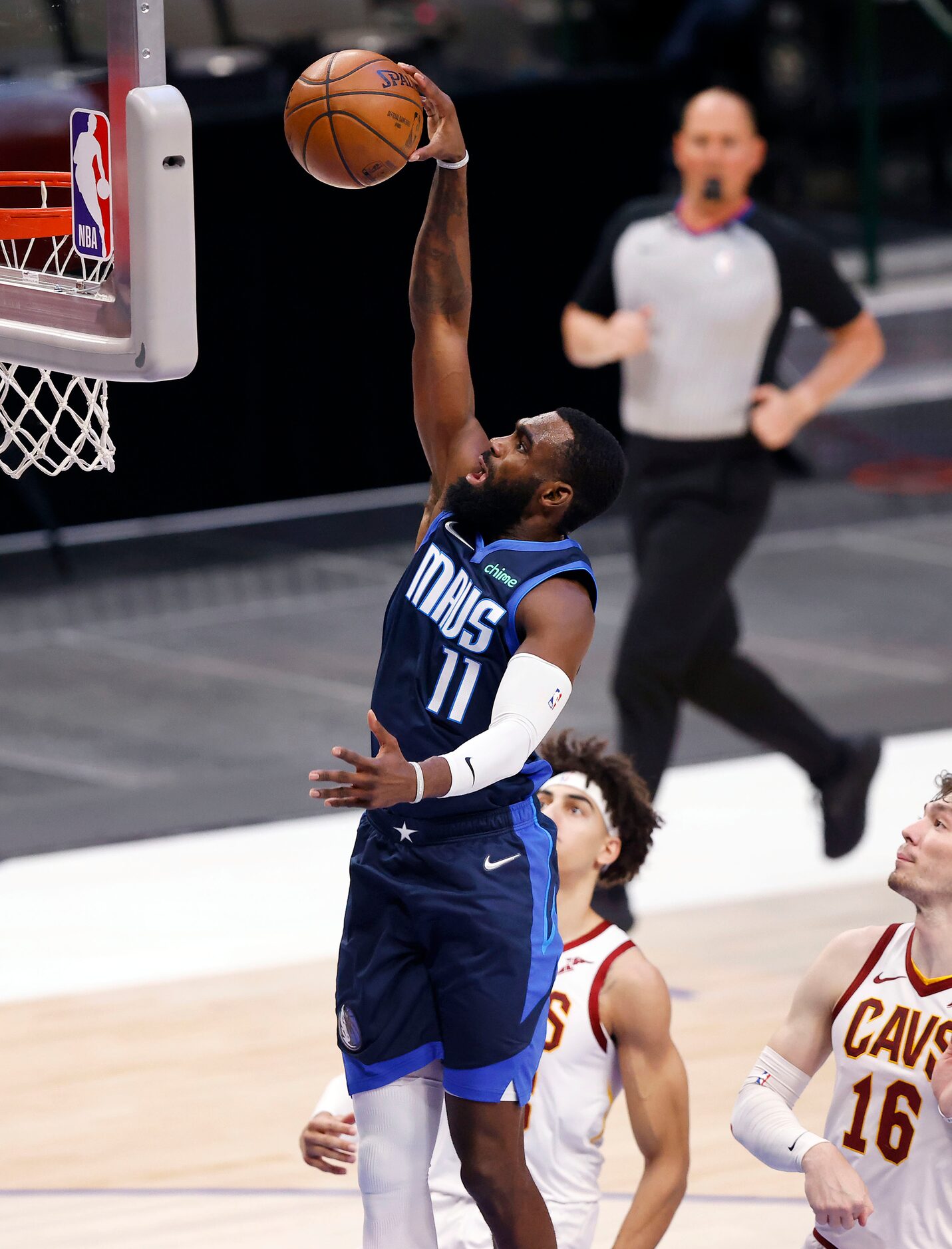 Dallas Mavericks forward Tim Hardaway Jr. (11) fleas to the basket for a first quarter dunk...