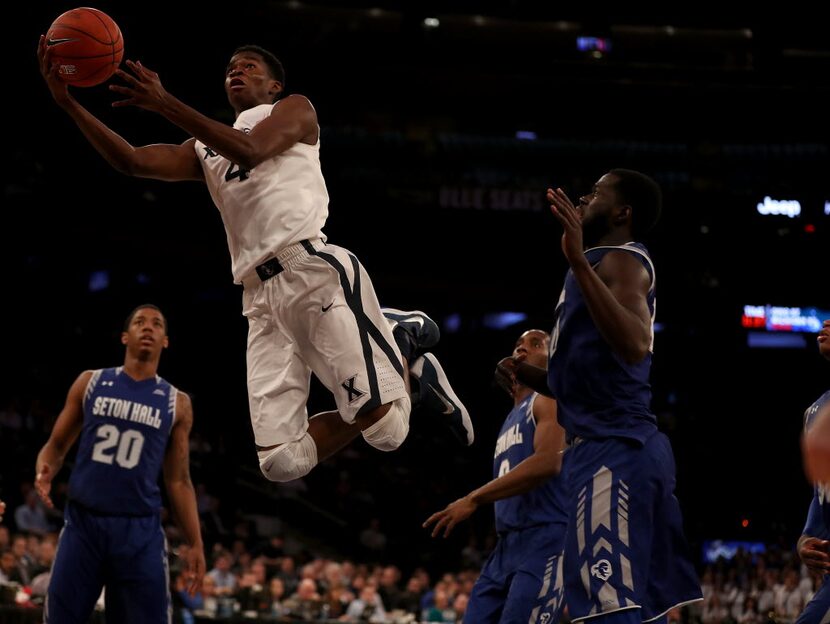 NEW YORK, NY - MARCH 11:  Edmond Sumner #4 of the Xavier Musketeers drives past the Seton...