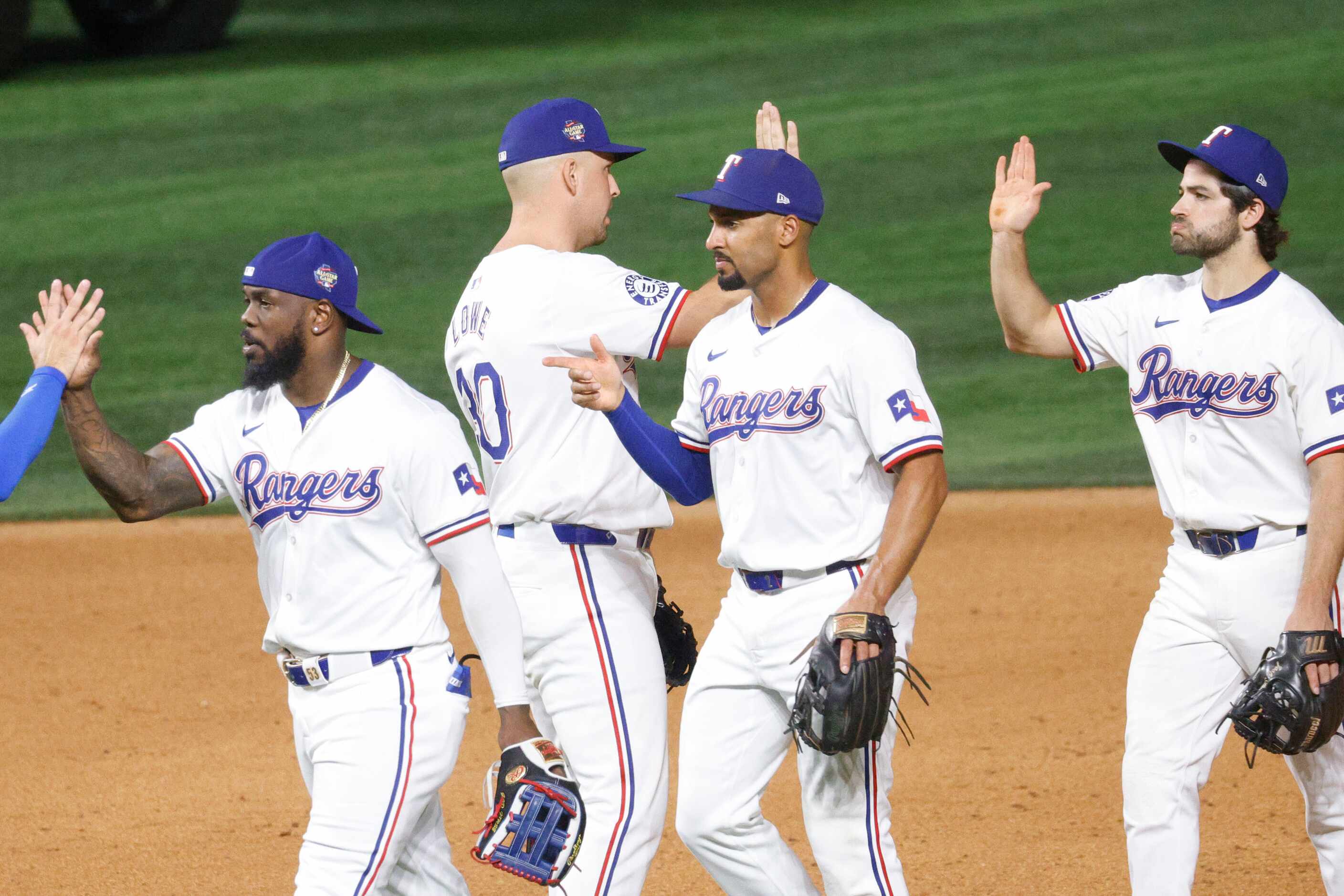 Texas Rangers outfielder Adolis García (53), Texas Rangers first base Nathaniel Lowe (30)...