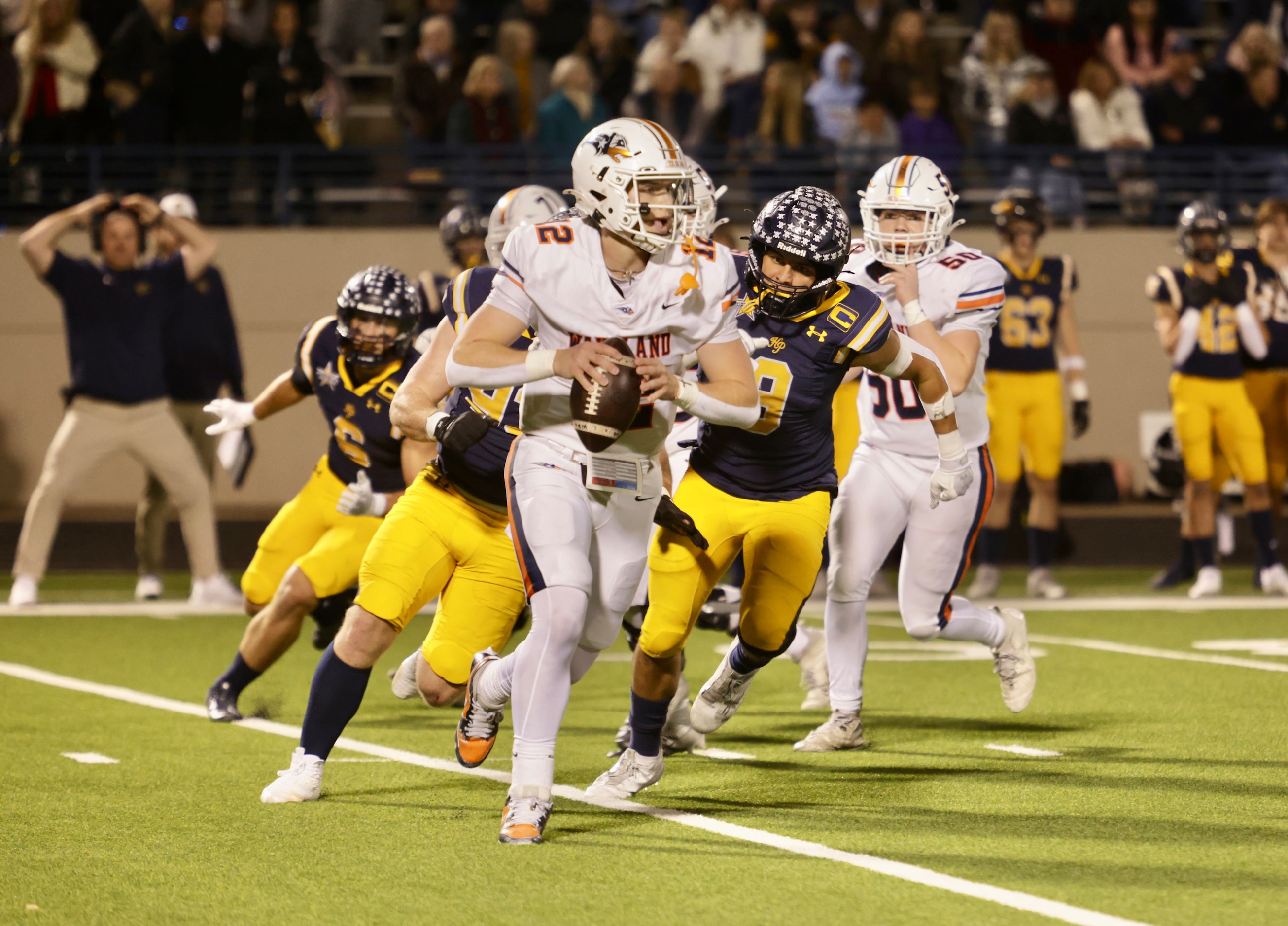 Frisco Wakeland quarterback Jayden Maples (12) looks for an open receiver during a high...