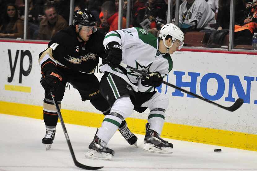 February 1, 2014; Anaheim, CA, USA; Dallas Stars left wing Antoine Roussel (21) moves the...