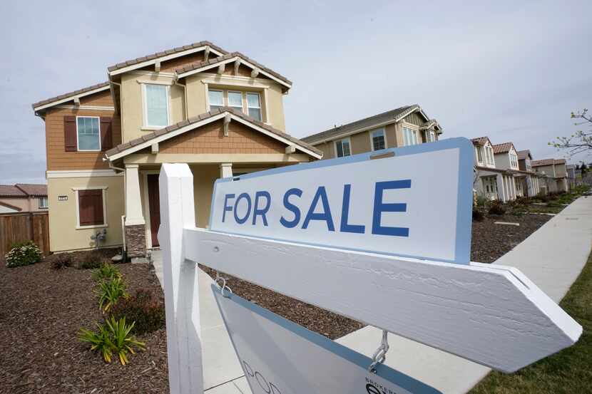 FILE - A "for sale" sign is posted in front of a home in Sacramento, Calif., March 3, 2022. ...
