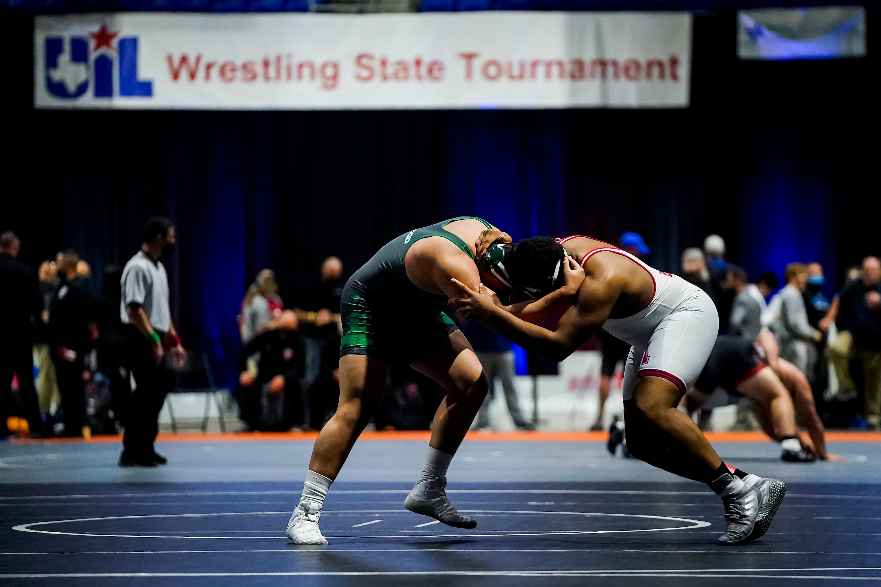 Emmett Bivens of Allen (right) wrestles Ivan Escobar of El Paso Montwood for the 6A boys...