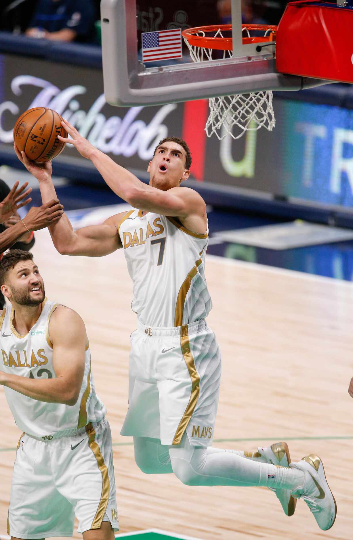 Dallas Mavericks forward Dwight Powell (7) attempts a shot during the first half of an NBA...