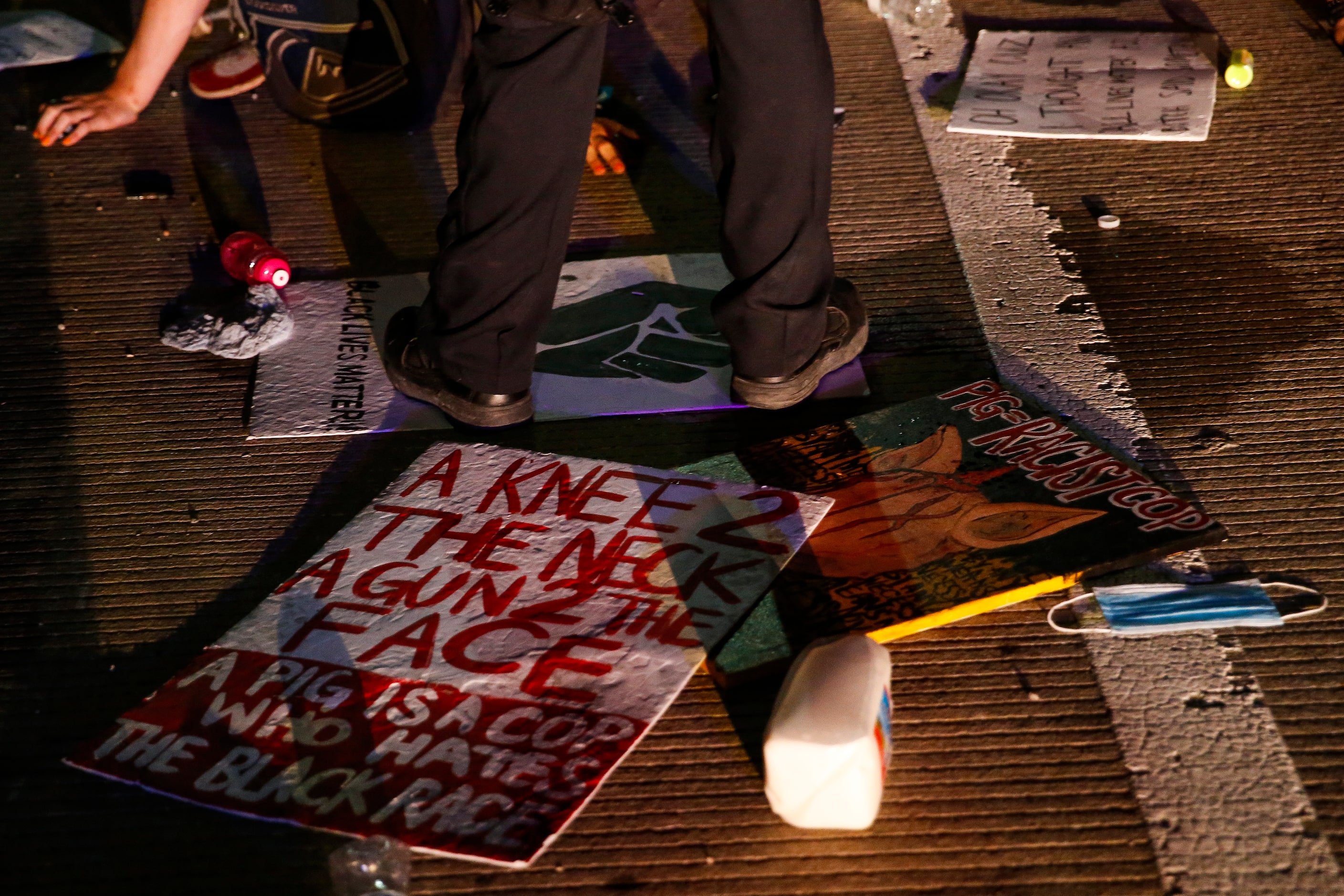 Police surround and detain hundreds of protesters who marched onto the Margaret Hunt Hill...