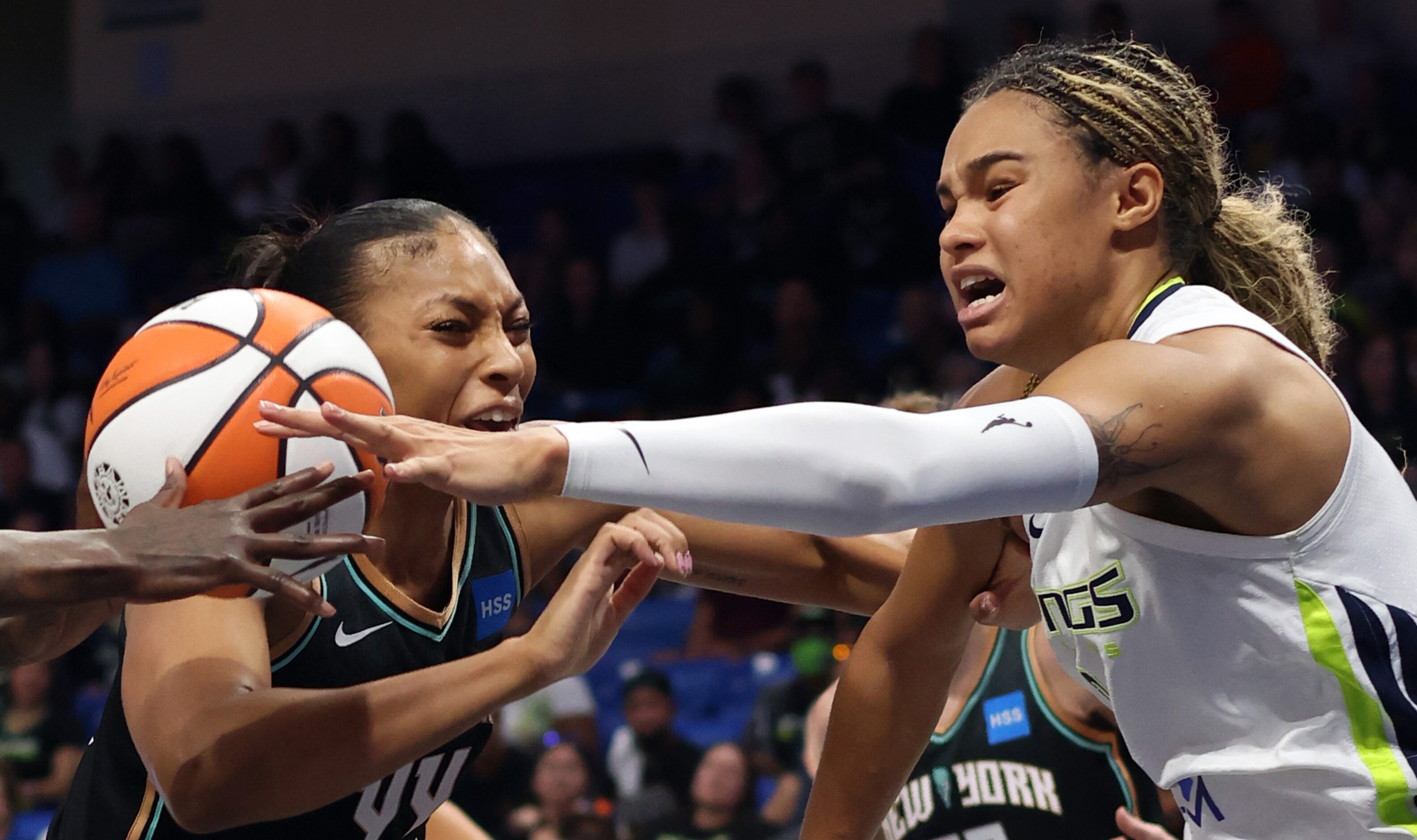 Dallas Wings forward Satou Sabally (0), right, battles with New York Liberty forward...