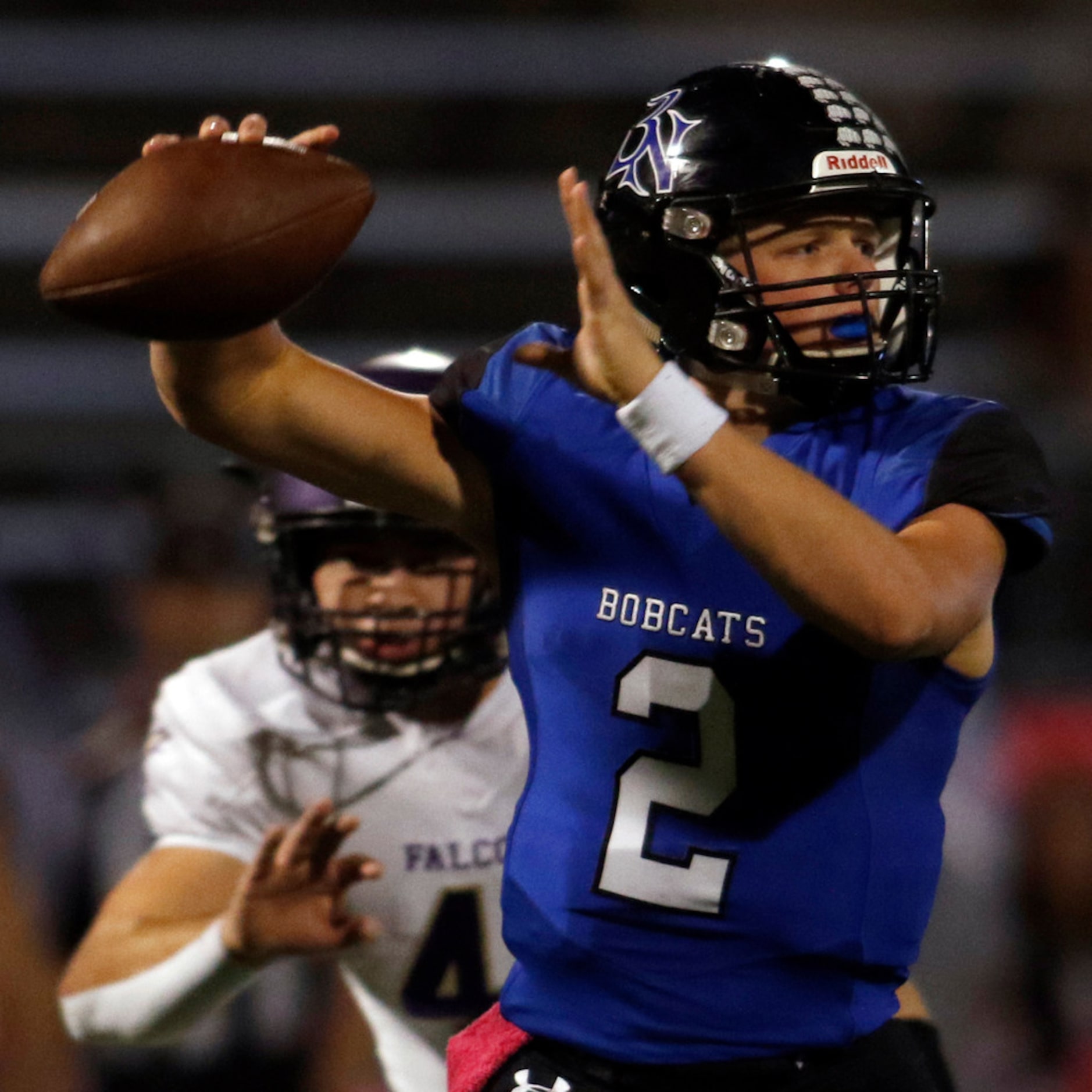 Trophy Club Byron Nelson quarterback Hudson White (2) looks to pass as Keller Timber Creek...