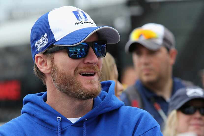 Dale Earnhardt Jr. stands on the grid prior to the NASCAR Sprint Cup Series AAA Texas 500 at...