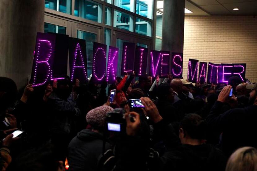 
Protesters held up letters that spelled out "Black Lives Matter" at a protest outside...