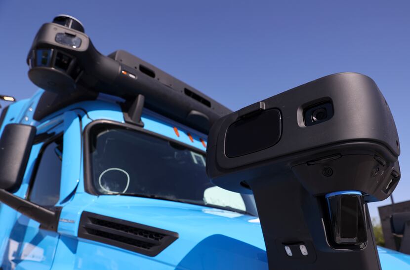 Cameras mounted on a Waymo Via truck sit on display at the company's new autonomous trucking...