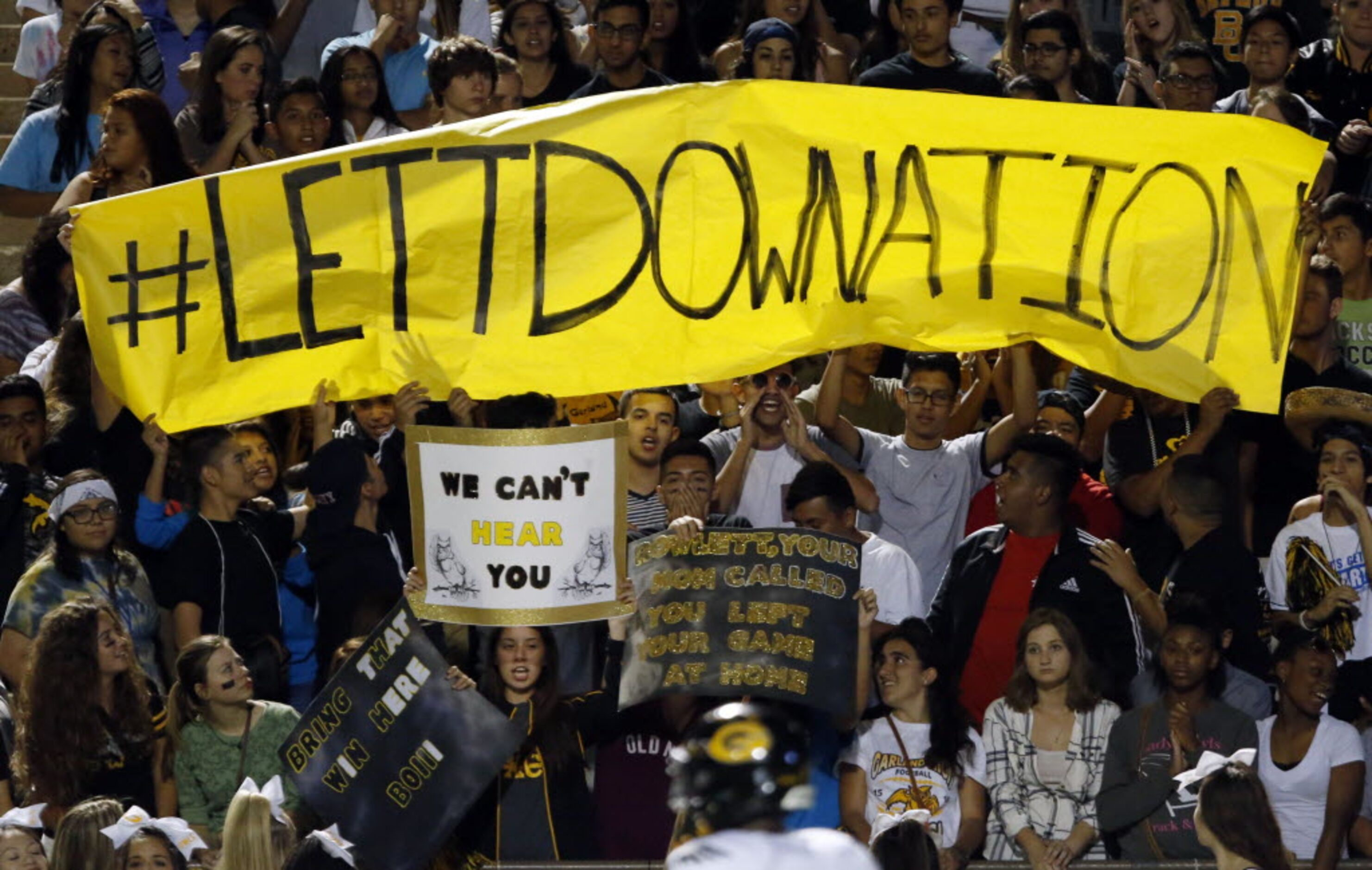 (TXHSFB) Garland High fans hold up a sign the reads "#LETTDOWNNATION" (A reference to...