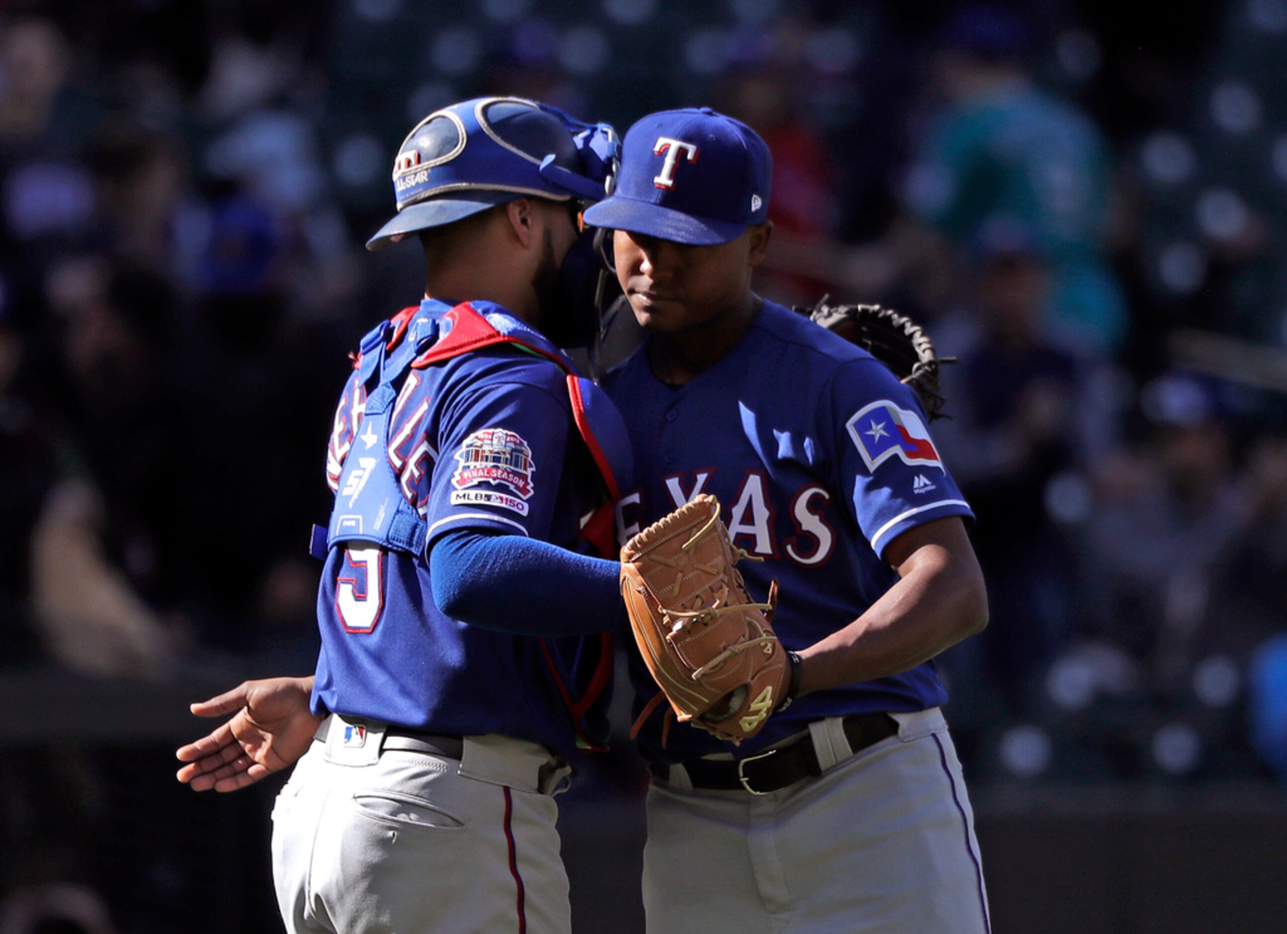 Texas Rangers closing pitcher Jose Leclerc, right, and catcher Isiah Kiner-Falefa embrace...